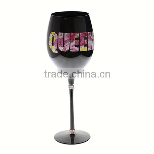 mouth blown black wine glass with decoration