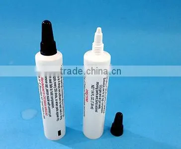 Cosmetic tube with silicone valve flip top