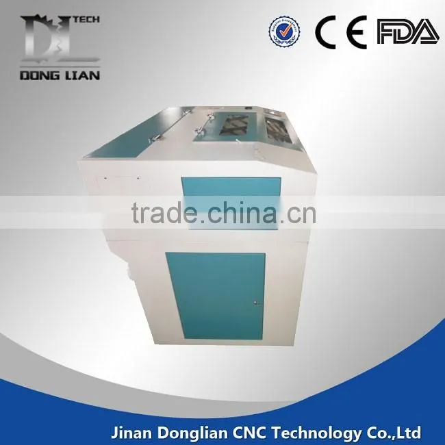 6040 small model alibaba hot sale jinan donglian used co2 laser cutting machine for pvc/glass