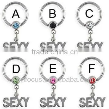 Captive bead ring with dangling "SEXY", 14 ga bcr piercing