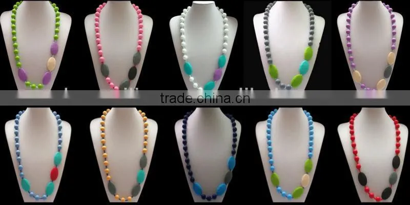 Turqoise silicone teething necklace for mom to wear and baby to enjoy