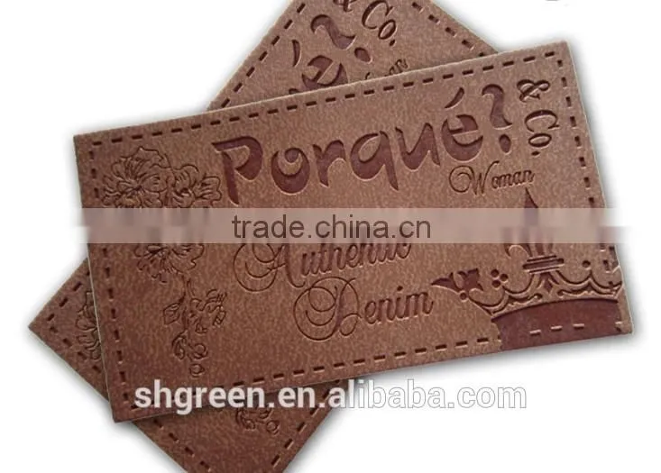 Dark brown irregular false leather label for pants
