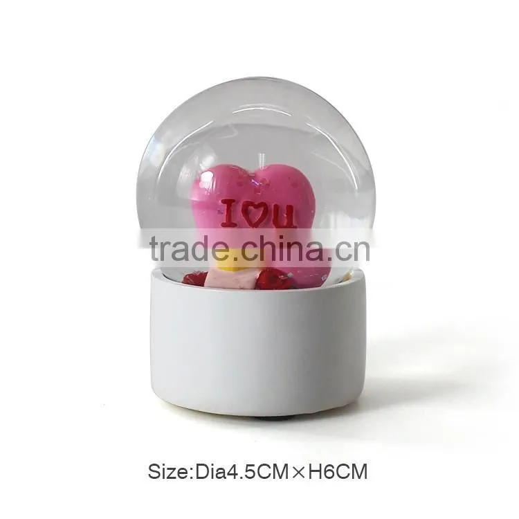 Small custom plastic snow globe