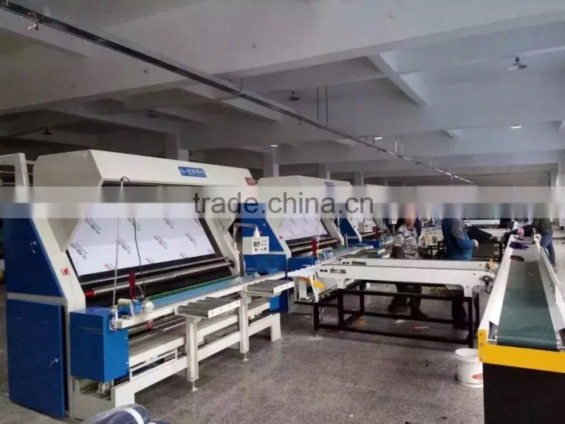 VERTICAL FABRIC-CUTTING MACHINE