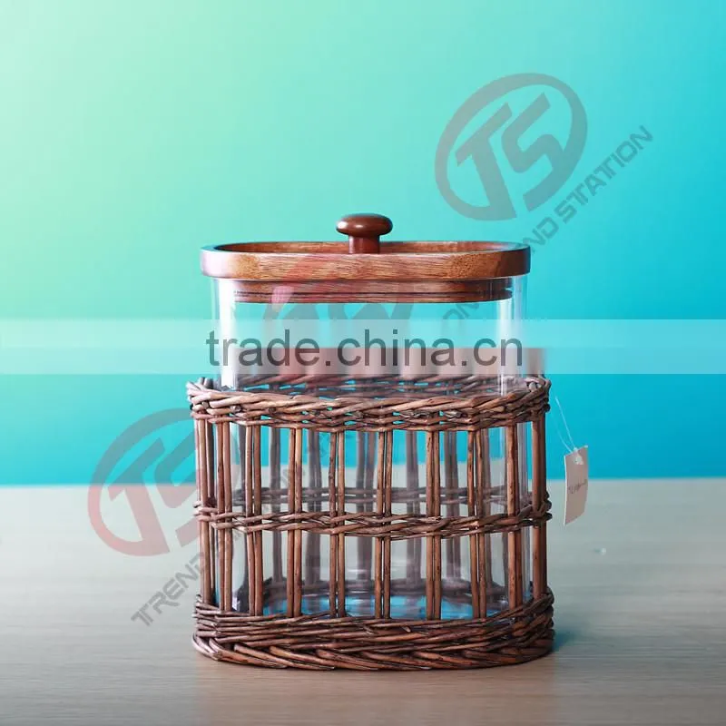 Glass herb storage jars with wooden and willow decoration