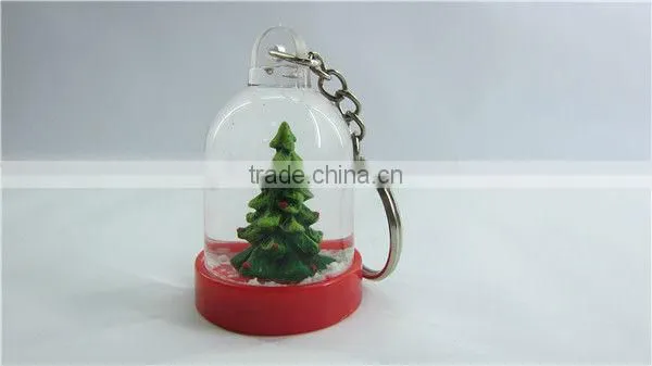 Plastic snow globe penguin key chain