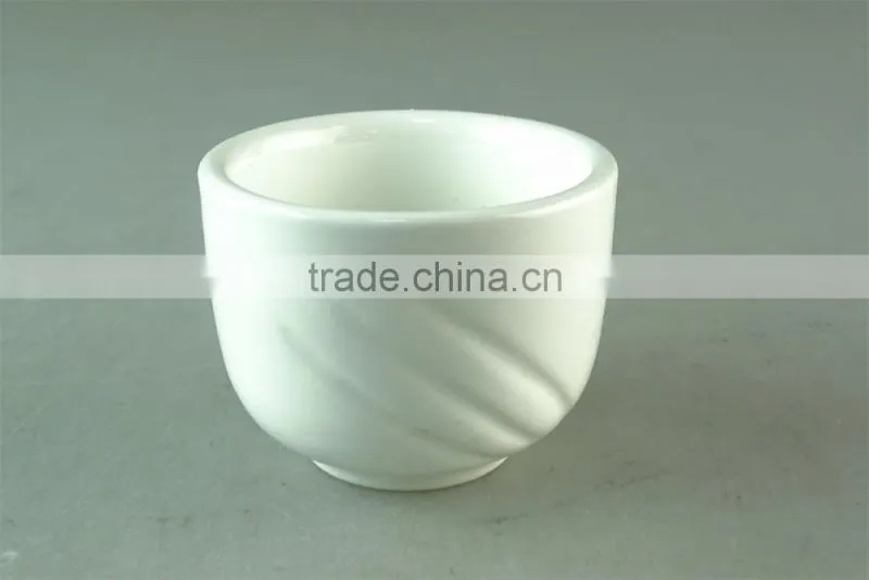 white porcelain cup with embossed wave design