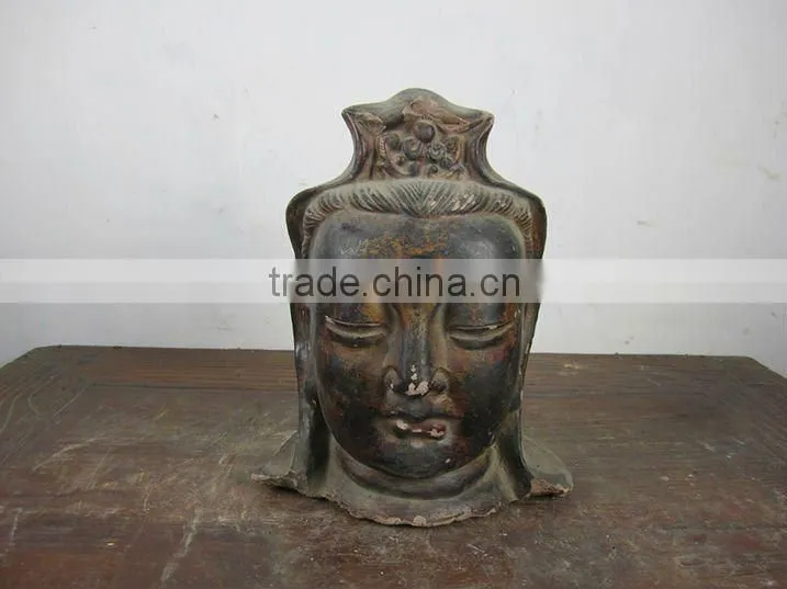 hand carved mud buddha head