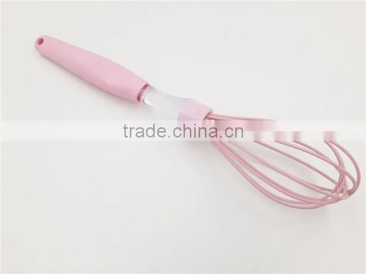 Pink silicone whisk