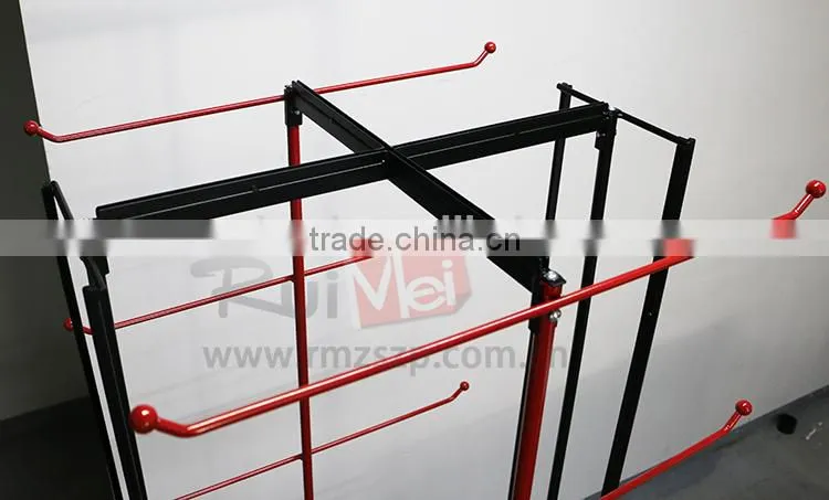 Red metal hanging bag display stand