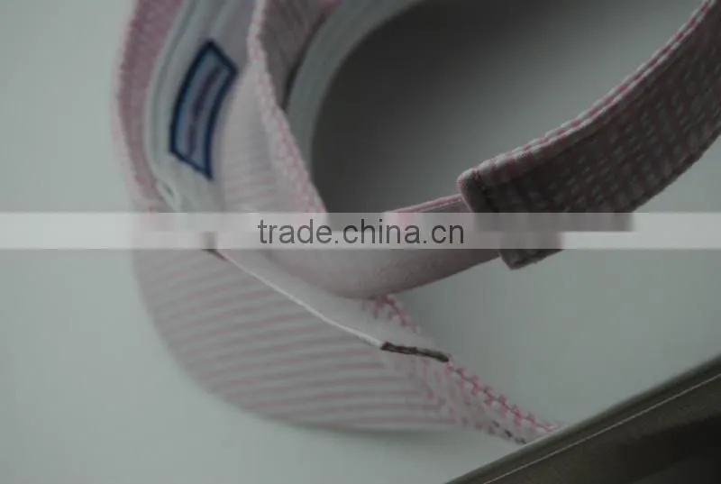white and pink curved brim sun visor cap