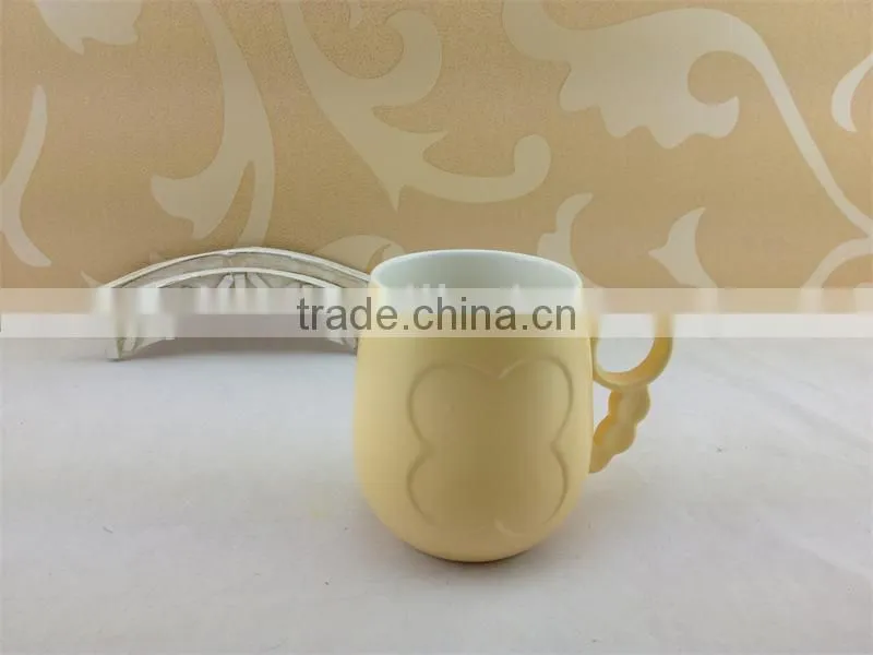 round handle embossed butterfly ceramic cup