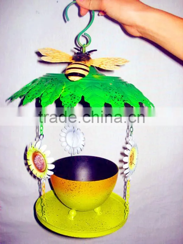 Colourful green handicraft bird feeder for garden