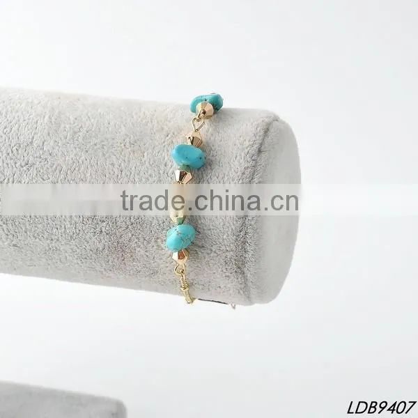 Antiquated cross with turquoise silver bangle cross bracelet