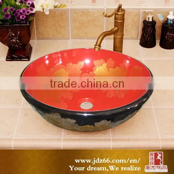 Black and red glaze installing bathroom basin with golden pattern
