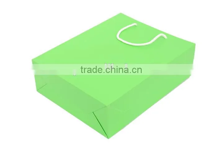 Green bright paper handmade handbag of gift box
