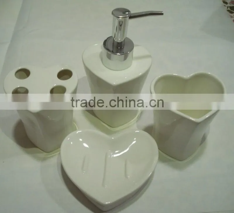 white ceramic bathroom set with heart shape
