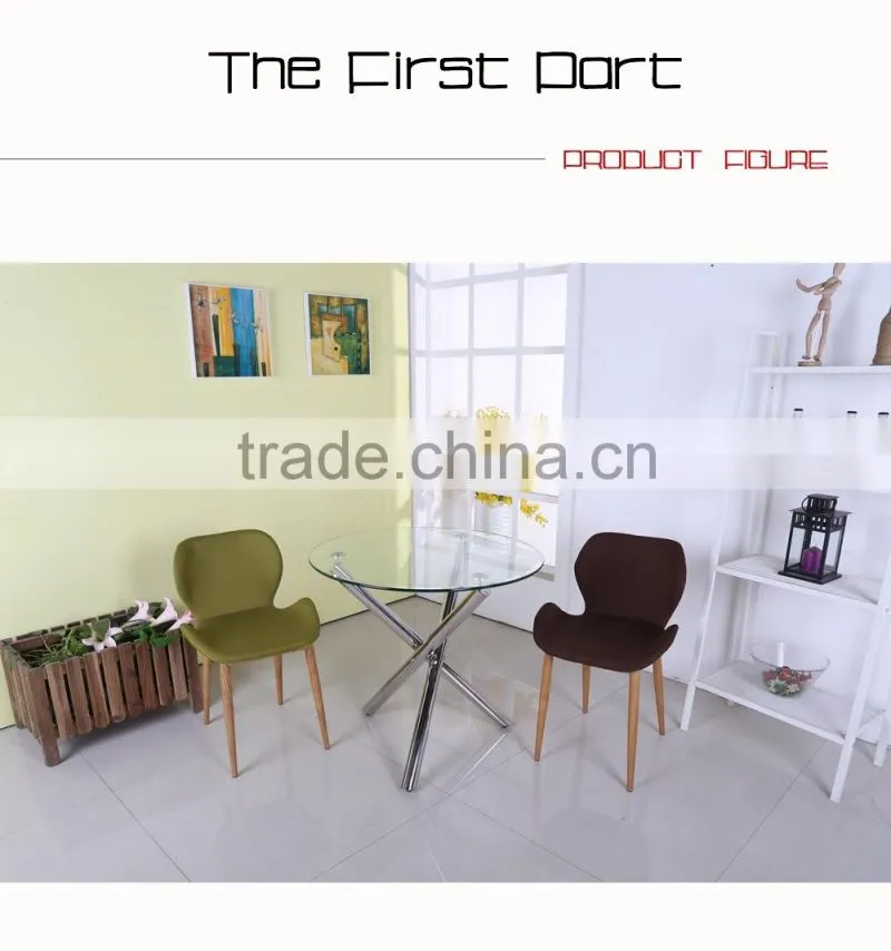 Round glass dining table with 3 metal legs