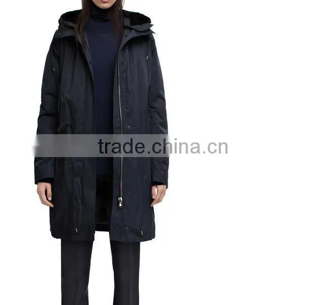 New powder navy is a nylon/waxed cotton blend parka jacket with a faux fur lined hood.