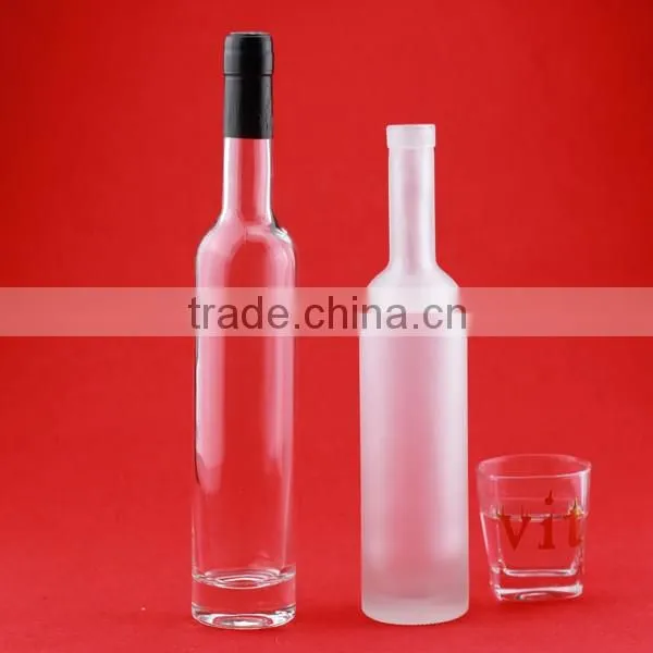 Bulk wholesale cheap cylindrical glass bottles frosted round bottles liquor bottles transparent