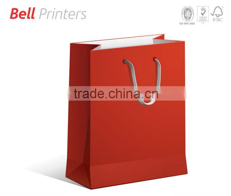 Pink color paper bag with heart shape hanging with handle
