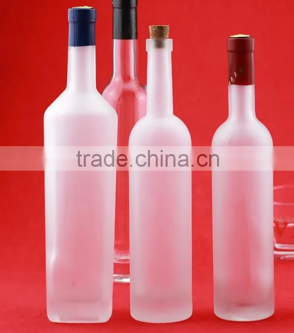 Bulk wholesale cheap cylindrical glass bottles frosted round bottles liquor bottles transparent