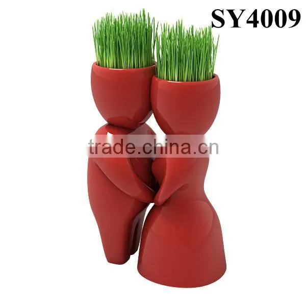 With grass hair white man growing grass doll