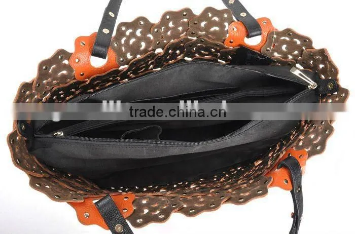 2012 fashion leather handbag ladies bag with punch flower patterns!