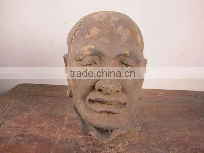 hand carved mud buddha head