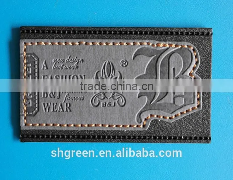 Dark brown irregular false leather label for pants