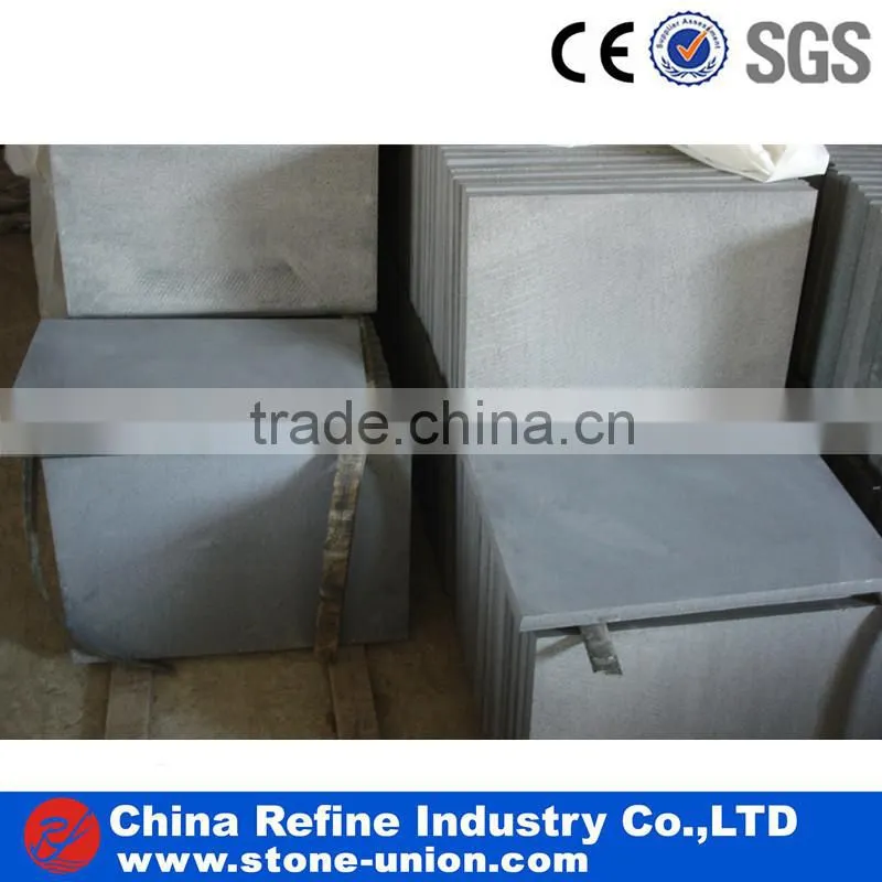 Bush-hammered finished grey basalt cube