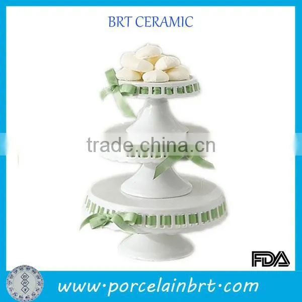 Wedding 3 tier ceramic cake stand with ribbon decorating cake