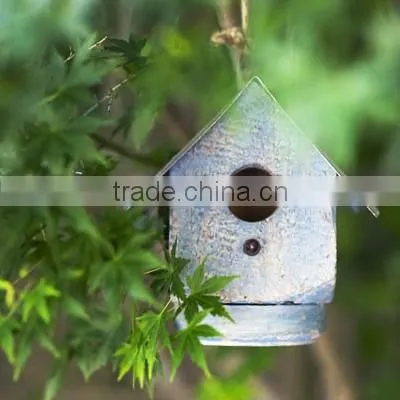 Rustic freestanding wooden bird cage outdoor