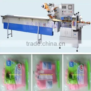 Full Automatic Rubber Gloves Flow Packaging Machine thumbnail-1