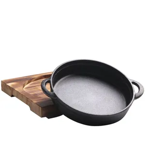 Round Wooden Base Cast Iron Sizzling Plate Two Ears New Design Cast Iron Paella Pan Deep Fry Pan thumbnail-1