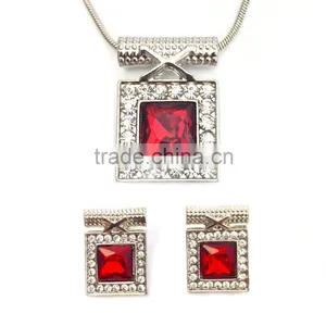 Large Red Crystal Surrounded by Clear Microset Crystals Necklace and Earring thumbnail-1