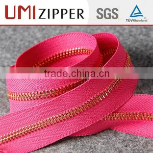 With no Zip Runner 30 cm no 4 Gold Brass Zipper Roll by Meter thumbnail-3