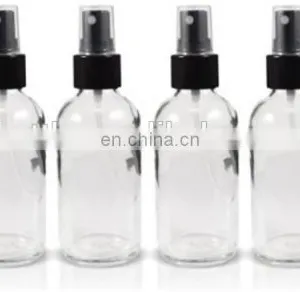 1 oz Clear Boston Round Glass Bottle With Black Fine Mist Spray thumbnail-2