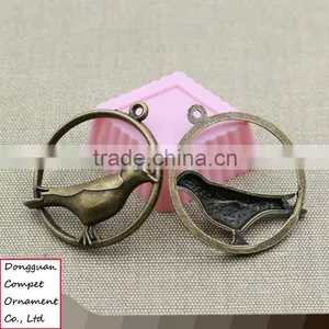 Wholesale Metal Plating Zinc Alloy Hollow Out Cuckoo Bird Pendant thumbnail-1