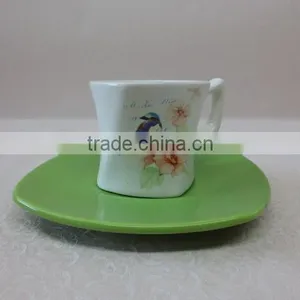 a Set of Small Ceramic Coffee Cup With Green Saucer thumbnail-1