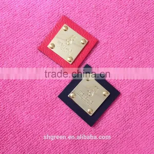 Shiny Golden Color Metal Badge on Black Leather thumbnail-1
