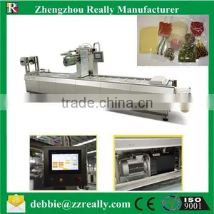 Continuing Vacuum Stretch Film Packing Machine Bread Stretch Vacuum Packing Machine thumbnail-1
