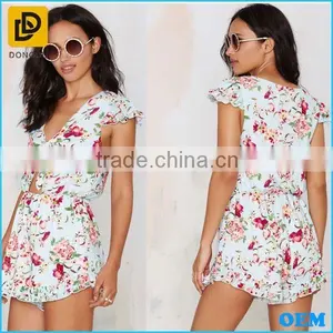 Light Blue Colorful Floral Print Romper Tie Closure At Neck Above Cutout & Ruffled Detailing At Hem And Sleeves thumbnail-1