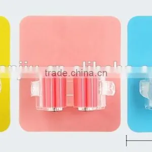 Wholesale Stock Magic Wall Suction Plastic Mop Handle Storage Holder thumbnail-2