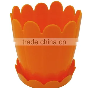 Orange Plastic Pot With Attached Saucer thumbnail-1