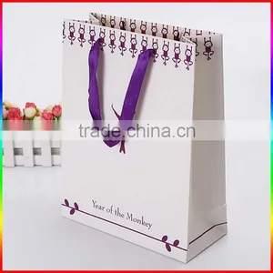 High Quality White Paper Gift Bag With Purple Ribbon thumbnail-1