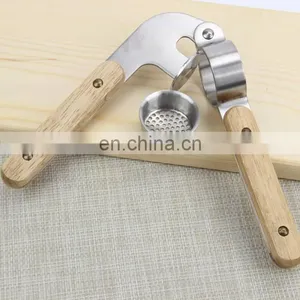 Hot Sale Stainless Steel Garlic Press With Wooden Handle thumbnail-3