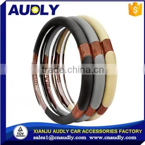 Custom Accessories Black Steering Wheel Cover With Woodgrain Design and Chrome Trim thumbnail-1