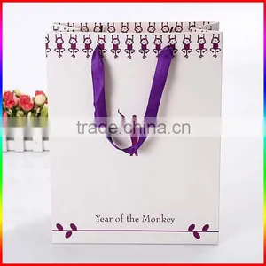 High Quality White Paper Gift Bag With Purple Ribbon thumbnail-3