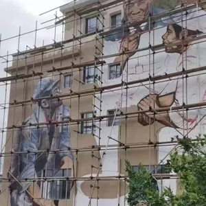 High - Altitude Wall Painting and Graffiti in High - Wall in Kashgar, Xinjiang. Hand - Painted Wall Graffiti Murals on Cooling Towers, Cooling Water Towers and Chimneys. Power Plant Beautification thumbnail-2